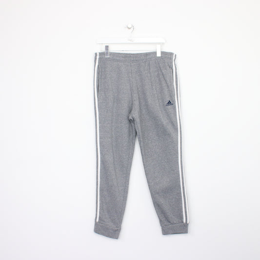 Vintage Adidas joggers in grey and white. Best fits L