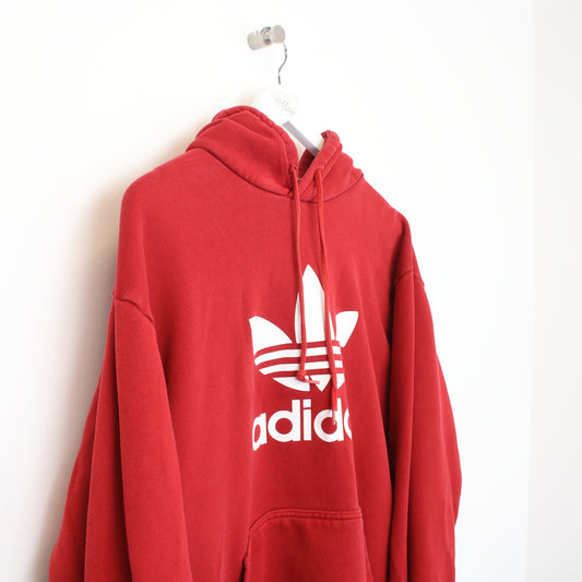 Vintage Adidas hoodie in red. Best fits L