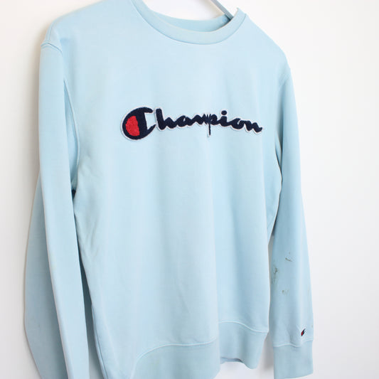 Vintage Champion sweatshirt in blue. Best fits S