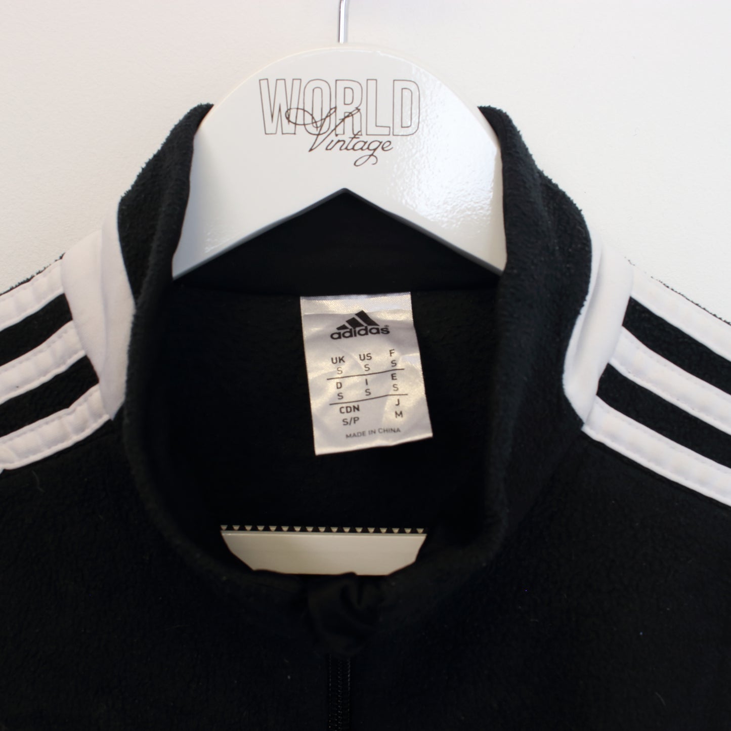 Vintage Adidas quarter zip fleece in black and white. Best fits S