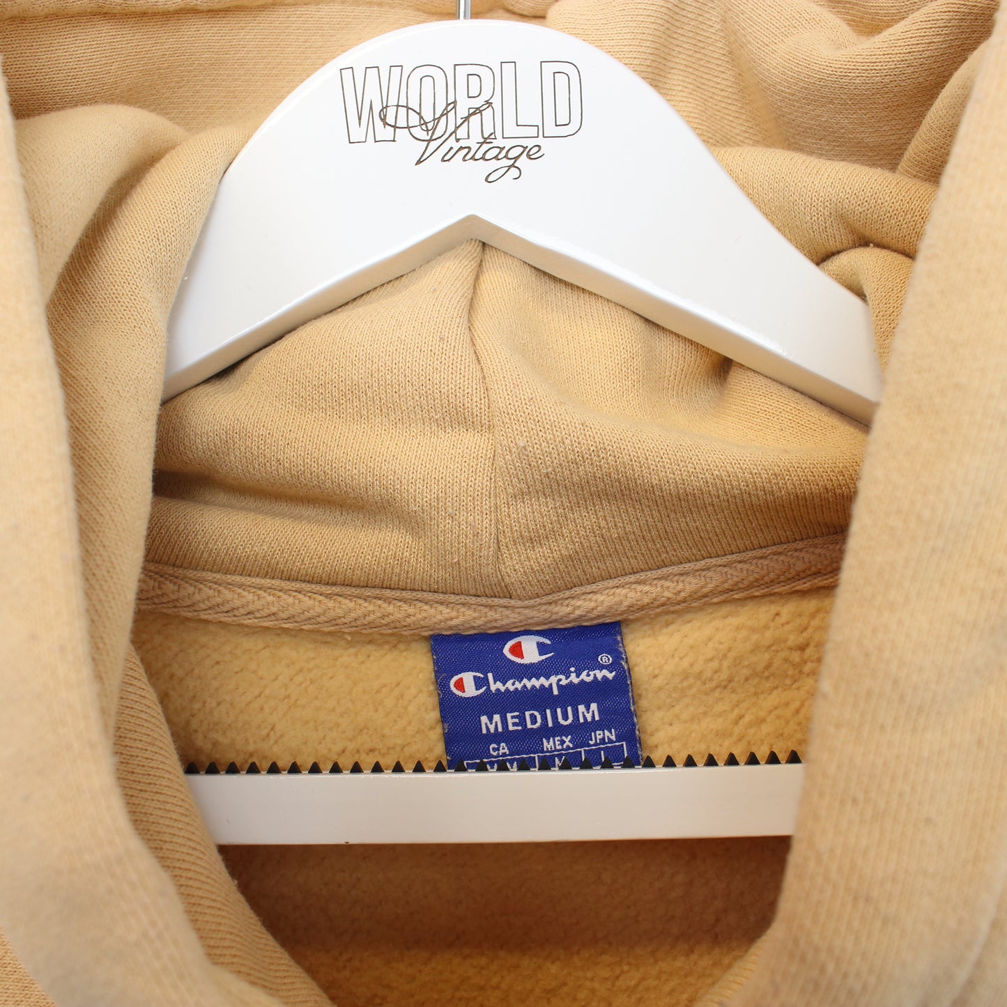 Vintage women's Champion cropped hoodie in beige. Best fits M