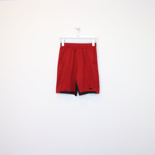 Vintage Nike shorts in red and black. Best fits M