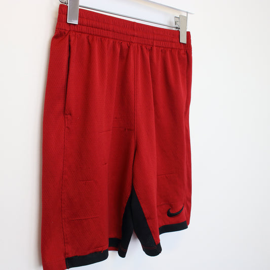 Vintage Nike shorts in red and black. Best fits M