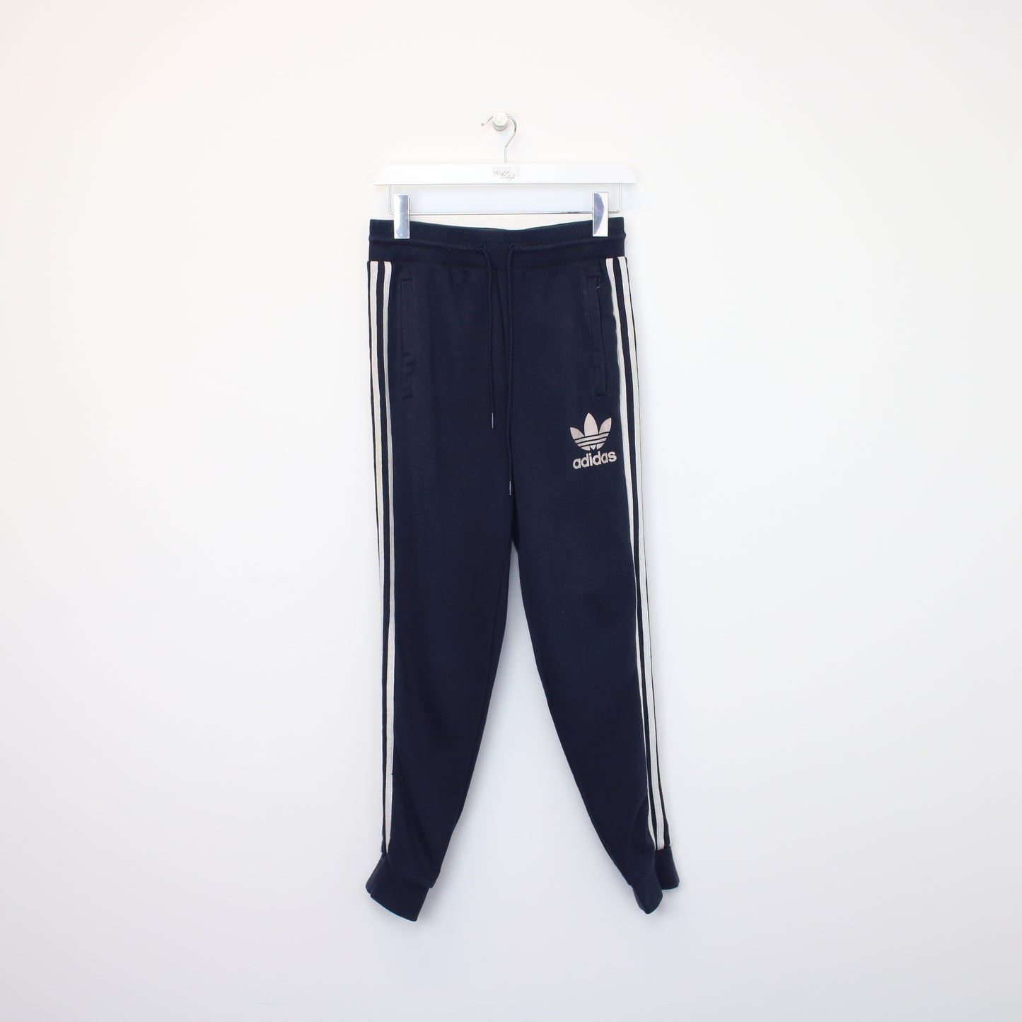 Vintage Adidas joggers in navy blue and white. Best fits XS