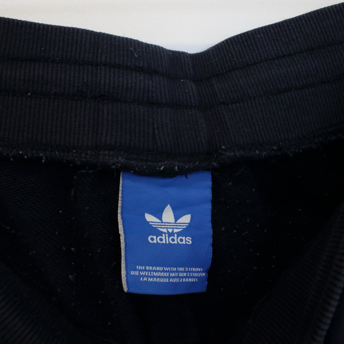 Vintage Adidas joggers in navy blue and white. Best fits XS