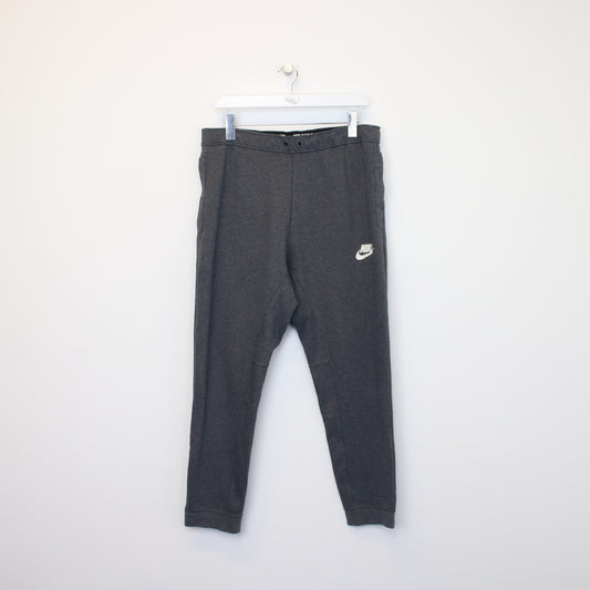 Vintage Nike joggers in grey. Best fits L