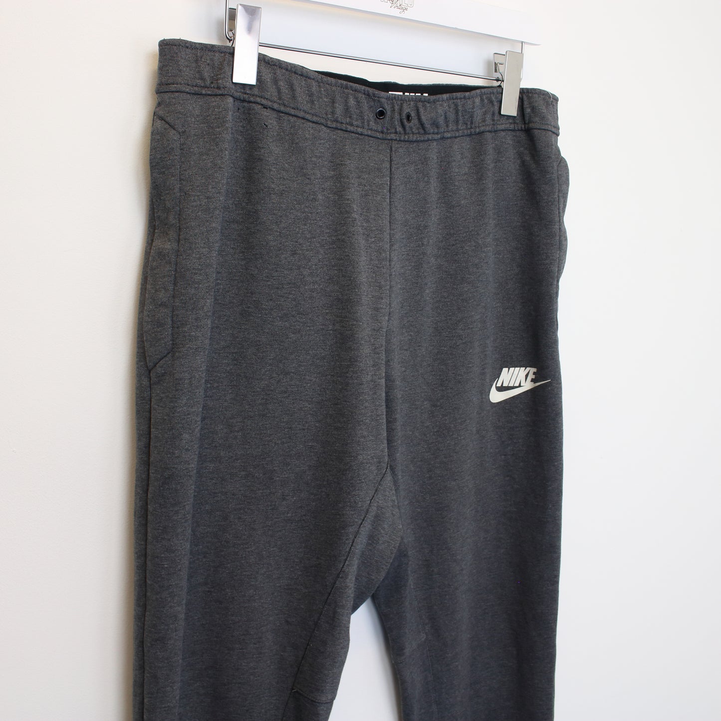 Vintage Nike joggers in grey. Best fits L