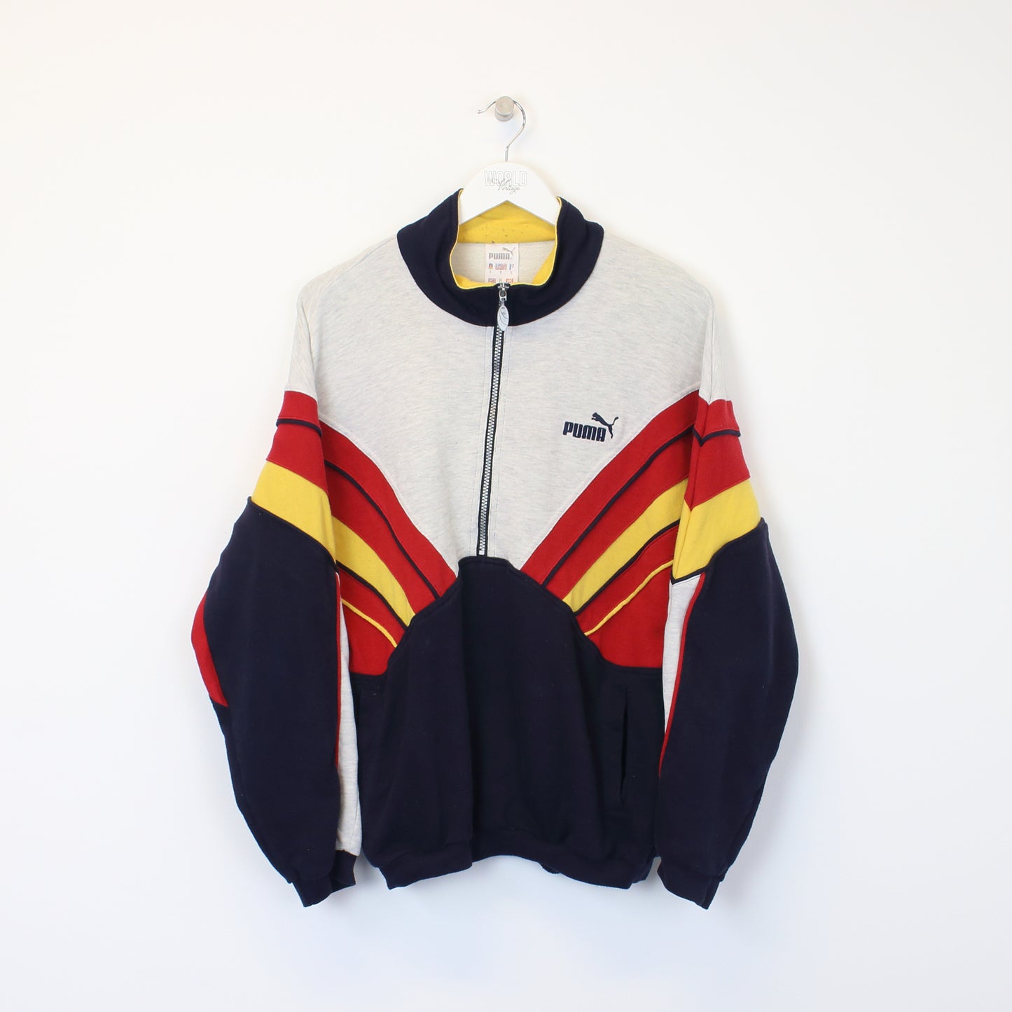 Vintage Puma sweatshirt in grey, red, yellow and blue. Best fits S