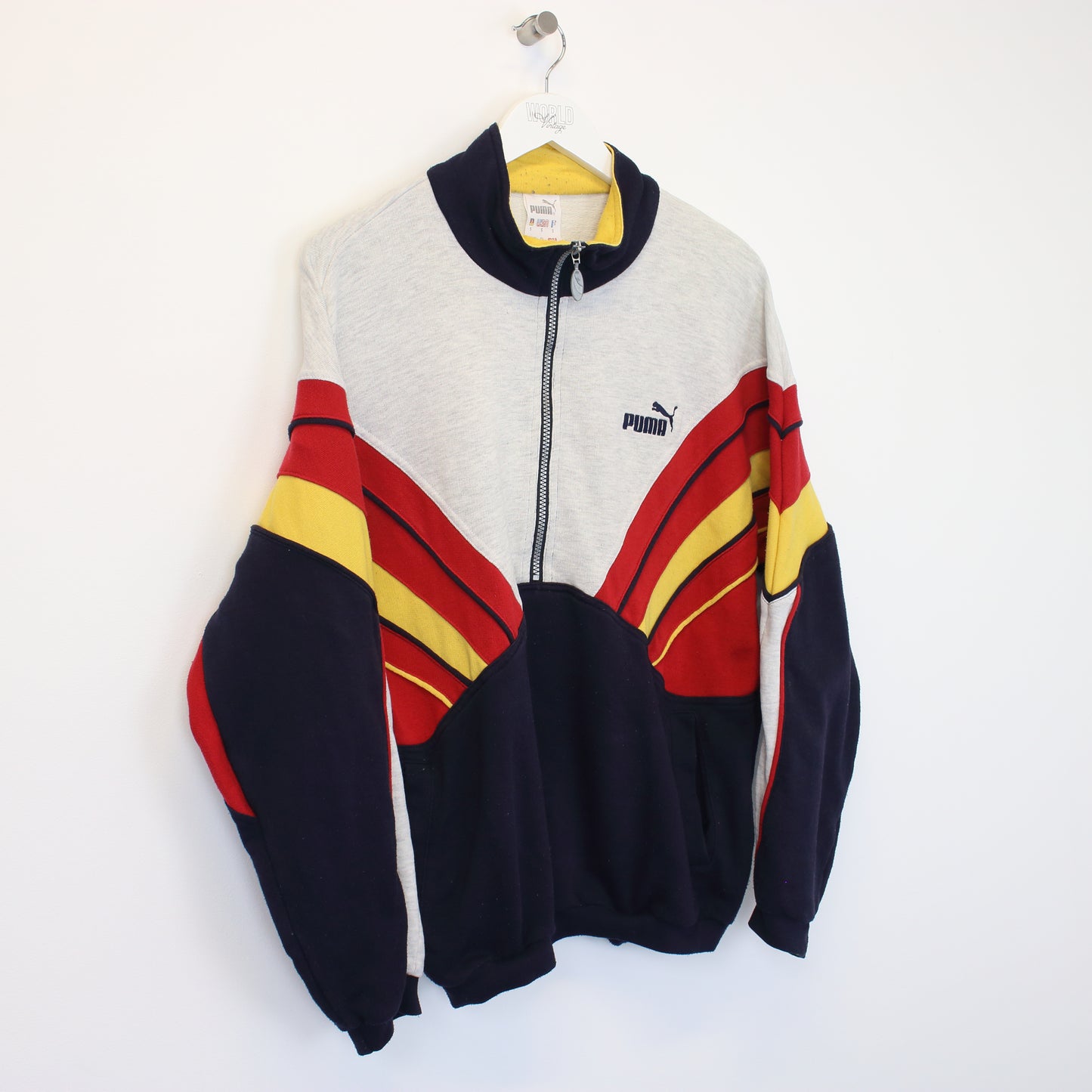 Vintage Puma sweatshirt in grey, red, yellow and blue. Best fits S