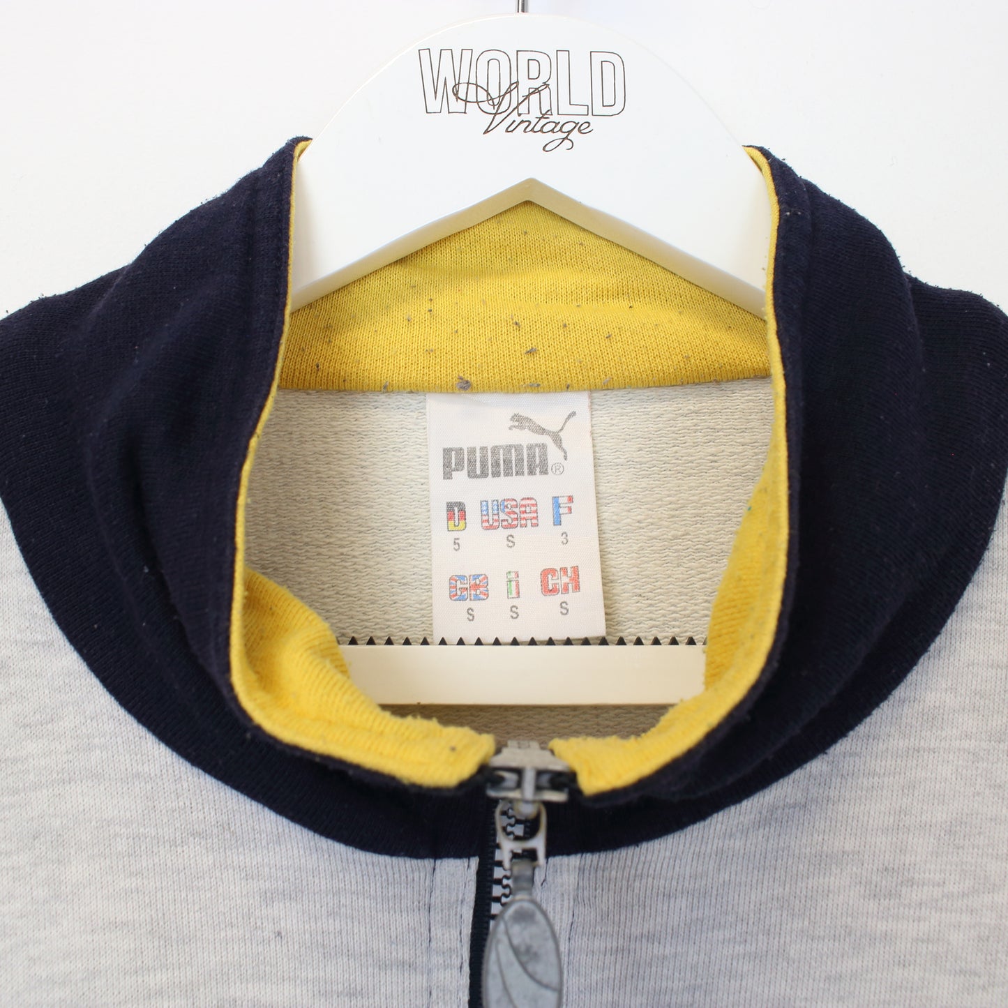 Vintage Puma sweatshirt in grey, red, yellow and blue. Best fits S