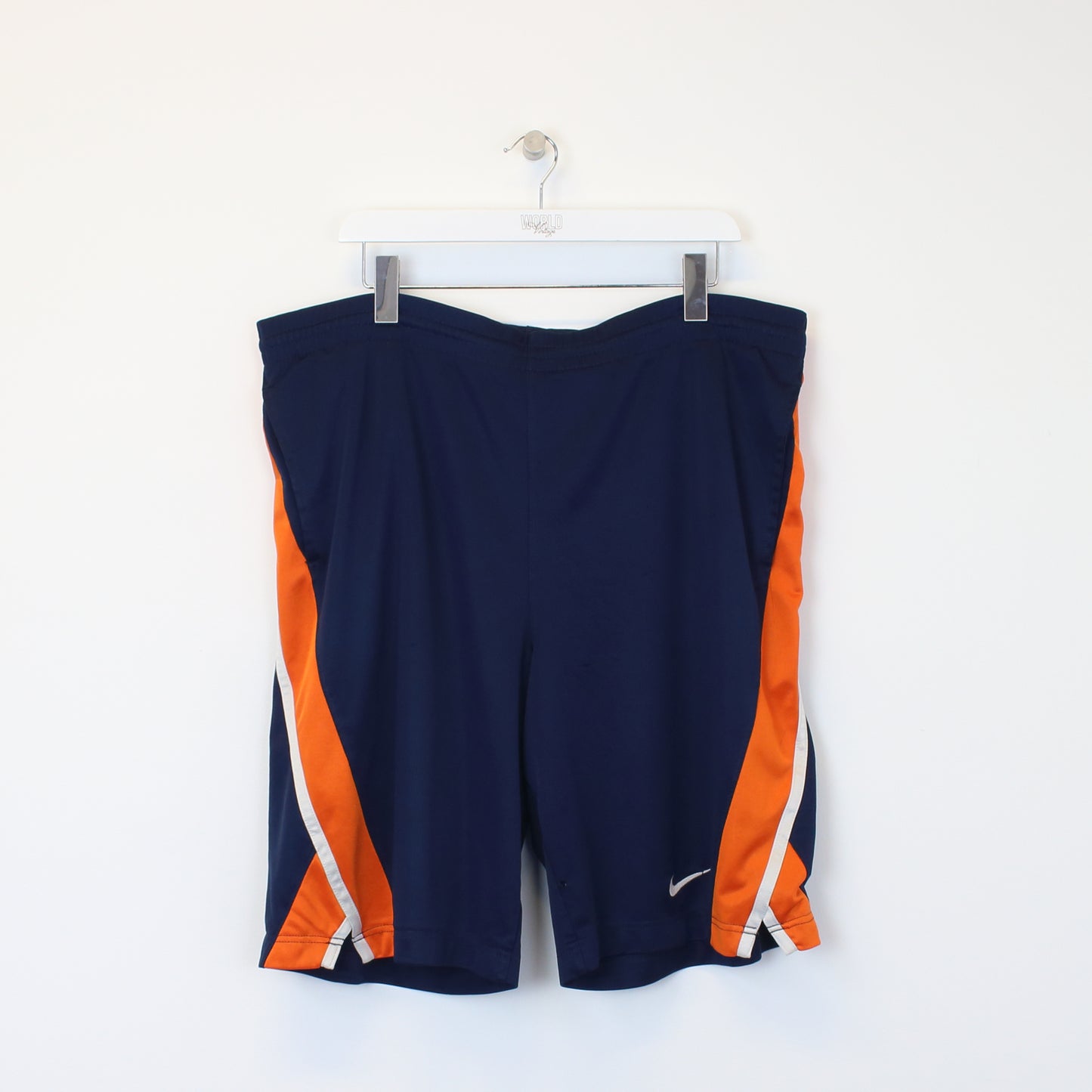 Vintage Nike basketball shorts in blue and orange. Best fits L