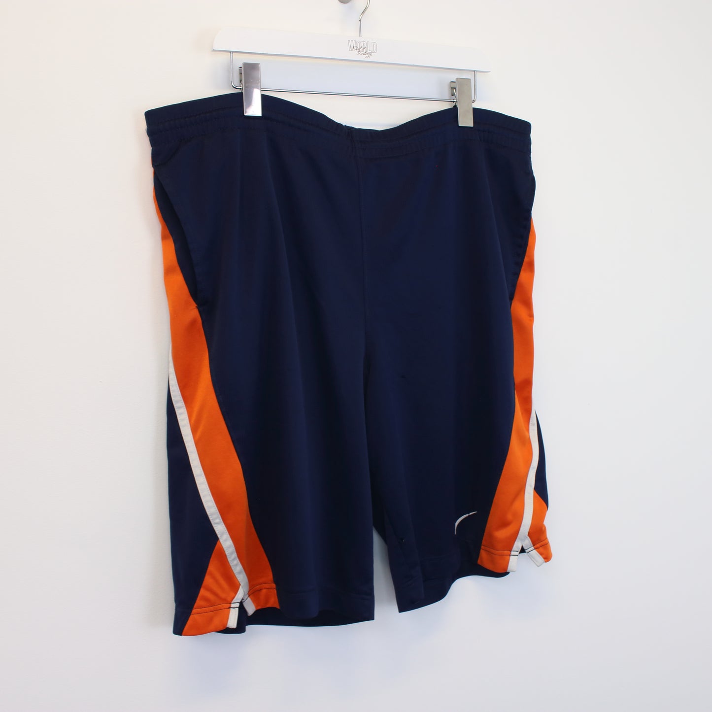 Vintage Nike basketball shorts in blue and orange. Best fits L