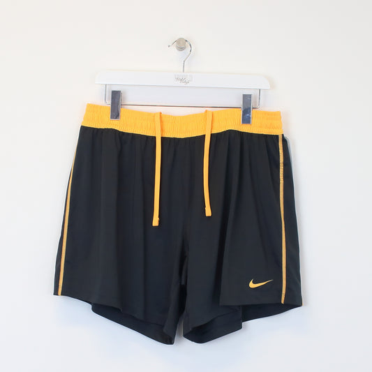 Vintage Nike shorts in orange and black. Best fits XL