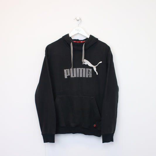 Vintage Puma hoodie in black. Best fits S