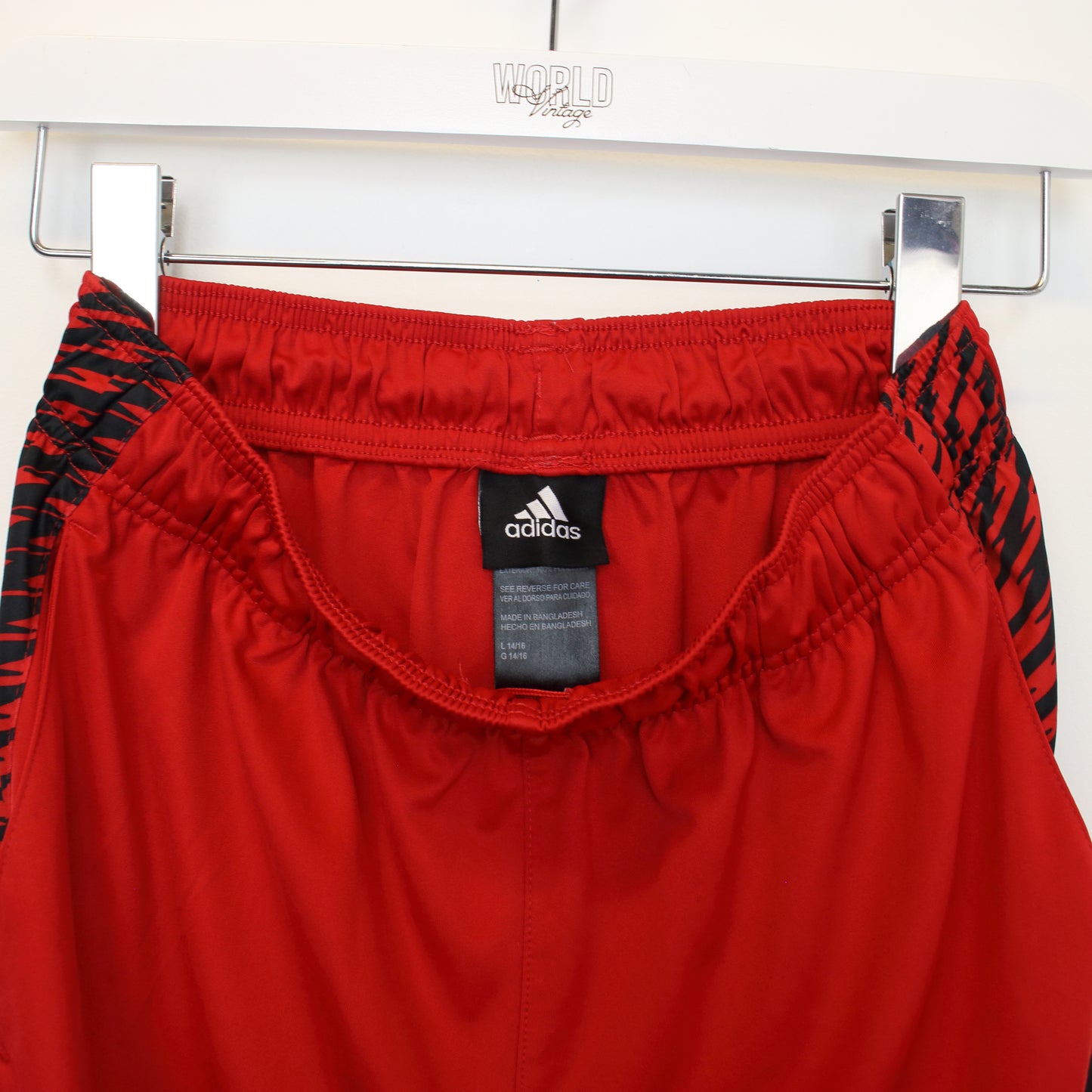 Vintage Adidas shorts in red and black. Best fits L