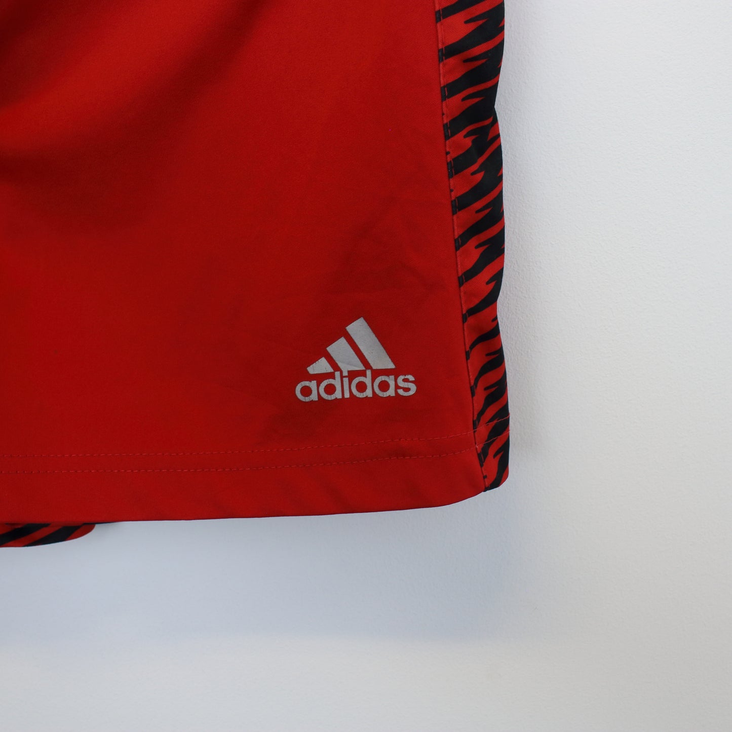 Vintage Adidas shorts in red and black. Best fits L