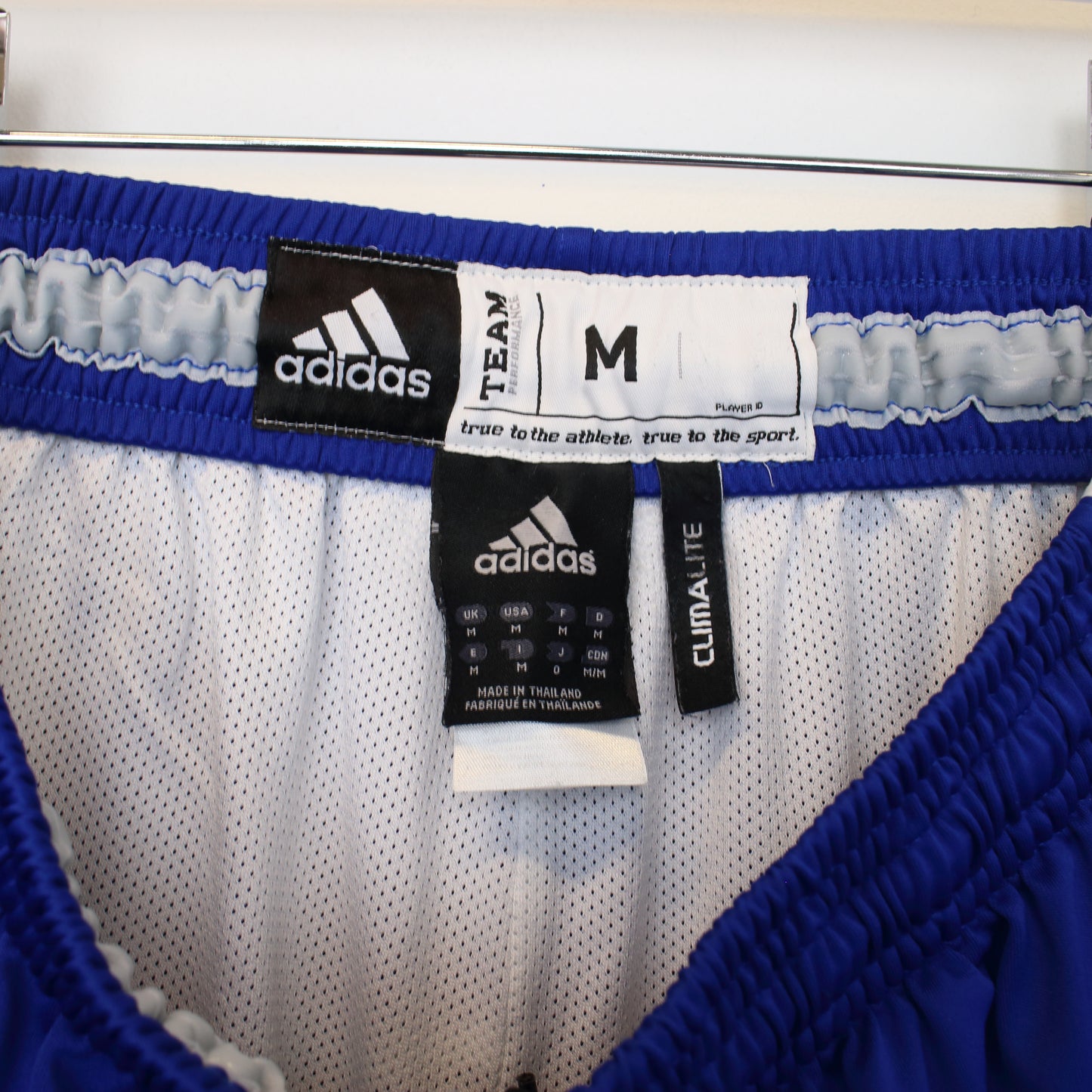 Vintage Adidas shorts in blue and white. Best fits M