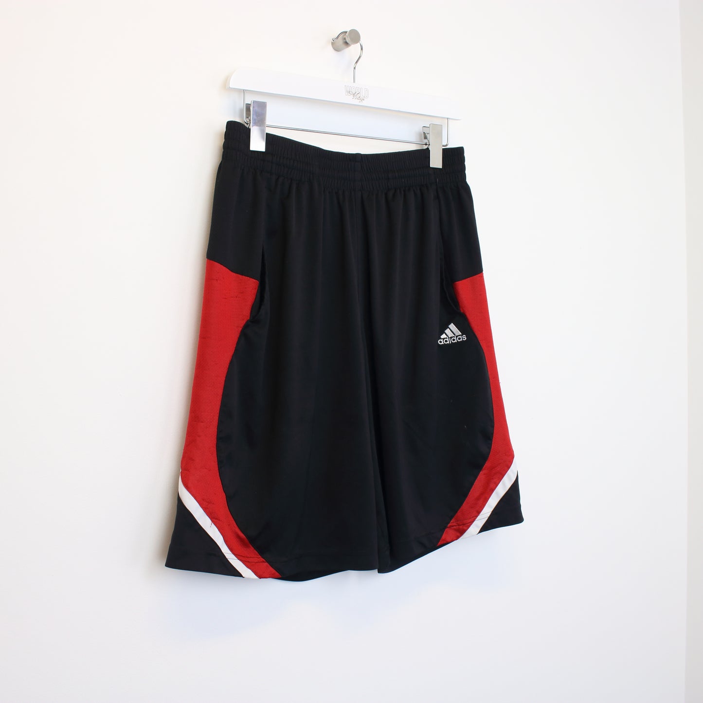 Vintage Adidas shorts in red and black. Best fits M