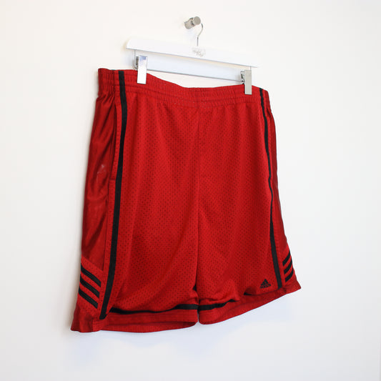 Vintage Adidas shorts in red and black. Best fits XXL