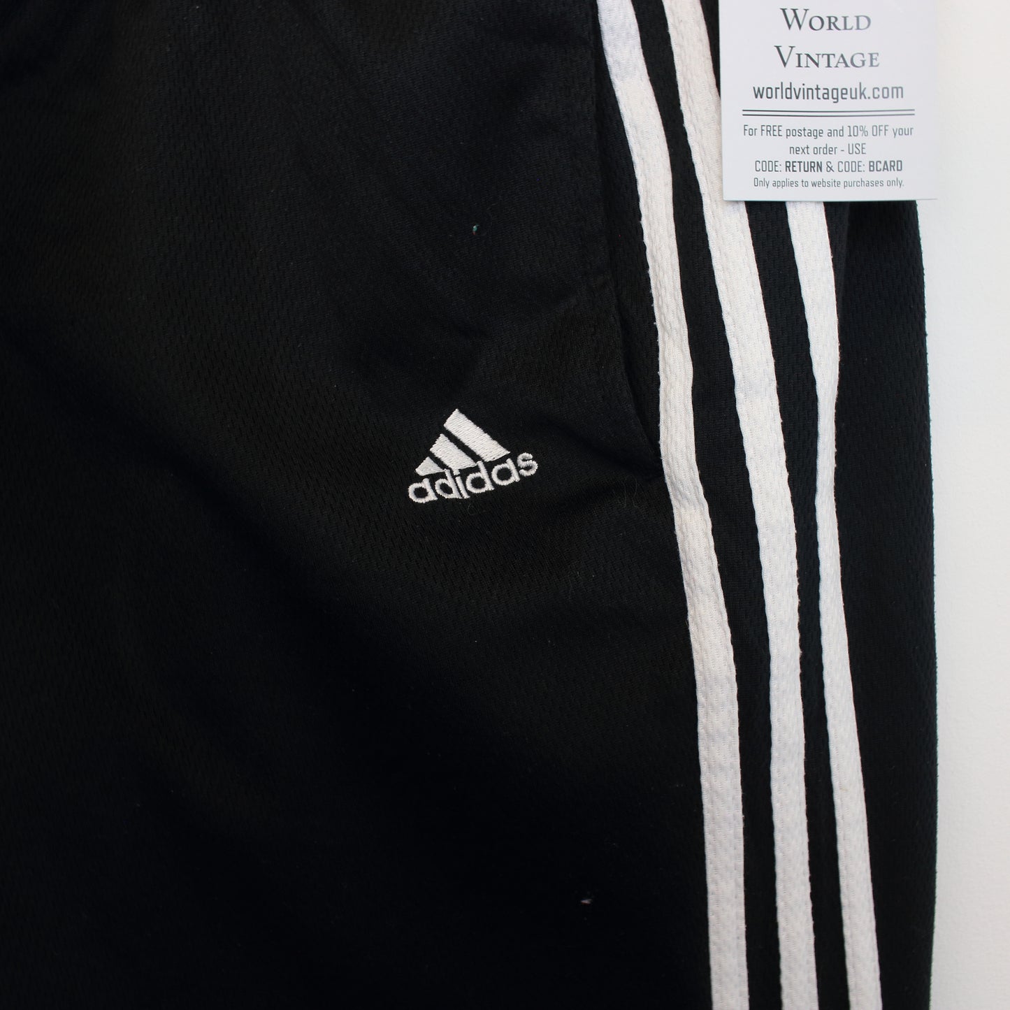 Vintage Adidas joggers in black and white. Best fits M