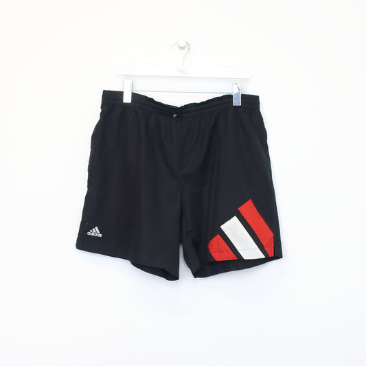 Vintage Adidas shorts in black, white, and red. Best fits XL