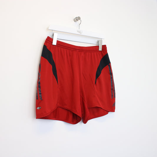 Vintage Adidas shorts in red. Best fits L