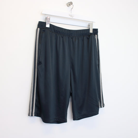 Vintage Adidas shorts in grey and black. Best fits XL