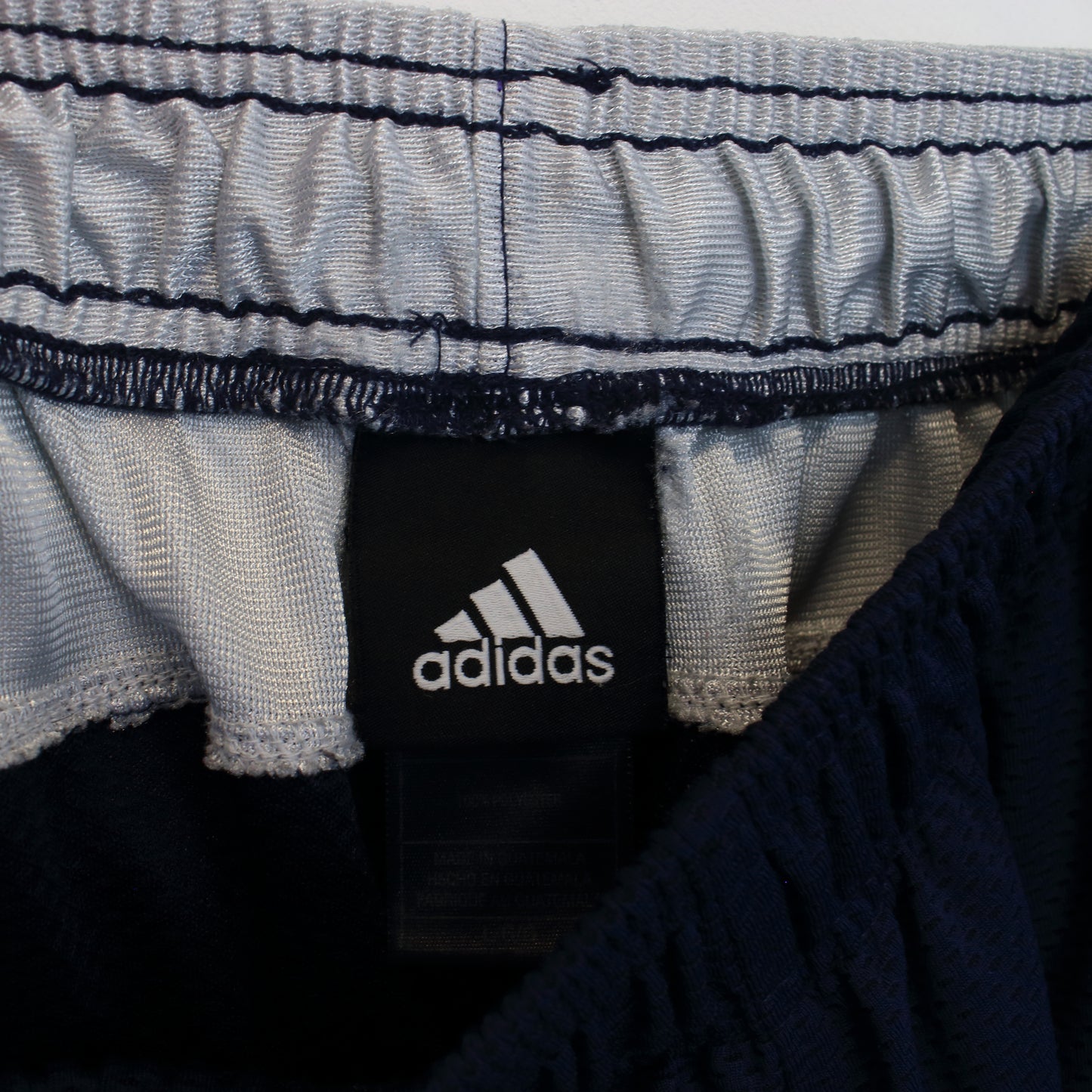 Vintage Adidas shorts in blue and white. Best fits L