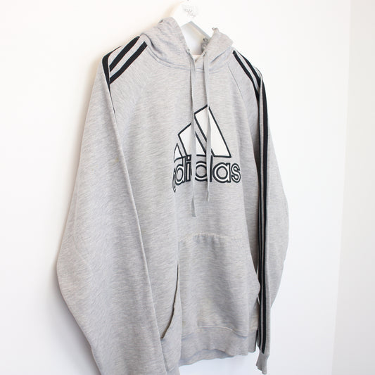 Vintage Adidas hoodie in grey. Best fits L