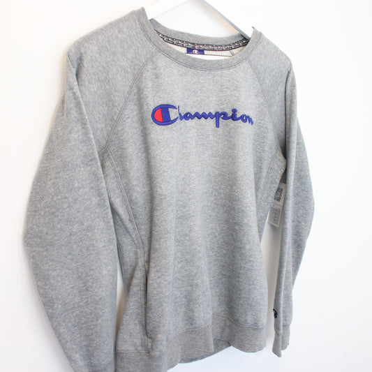 Vintage Women's Champion sweatshirt in grey. Best fits M