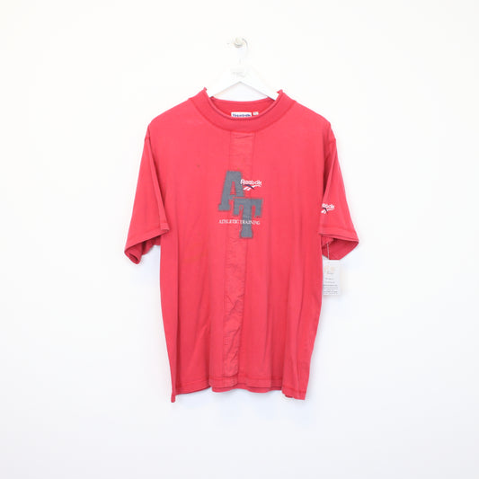 Vintage Reebok t-shirt in red. Best fits L