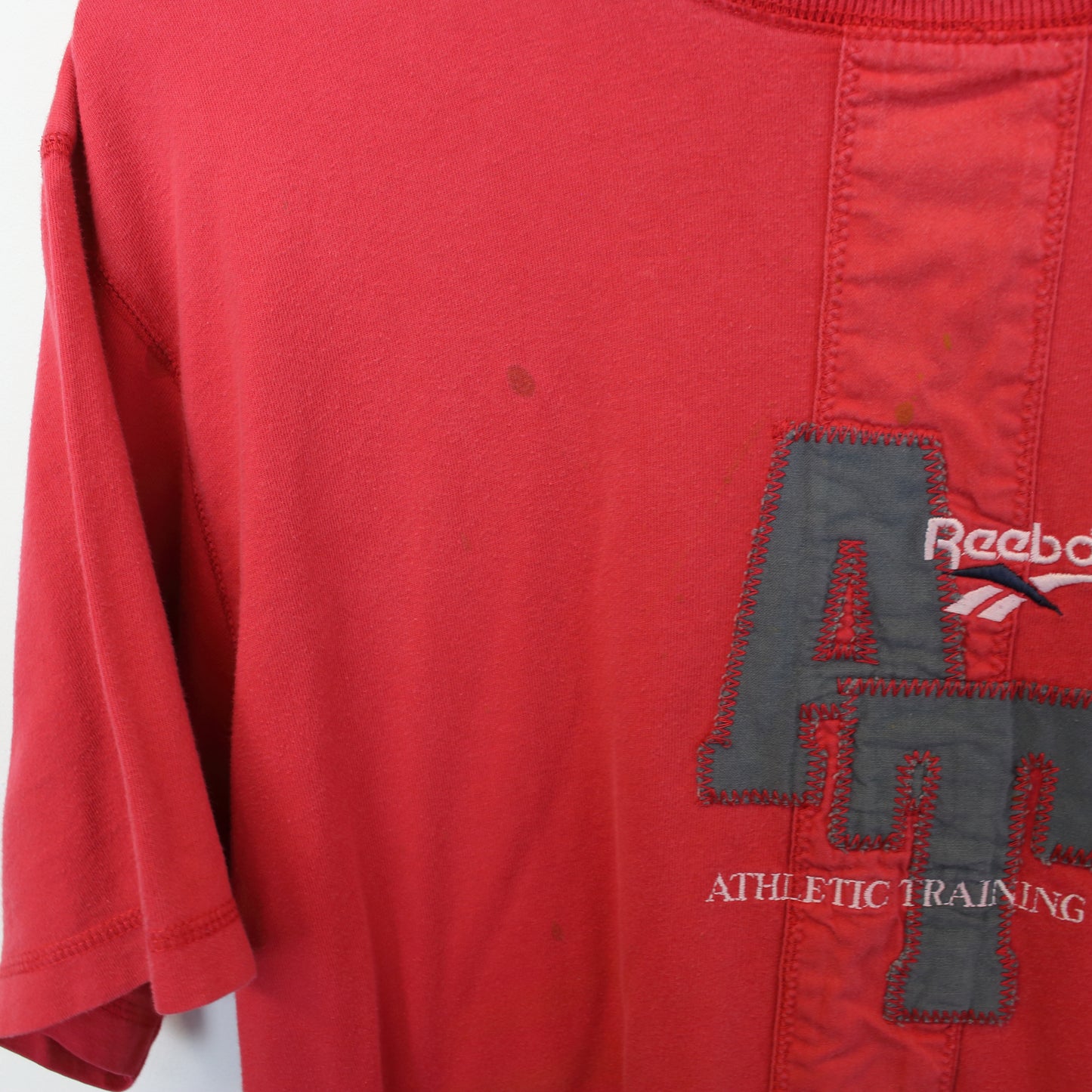 Vintage Reebok t-shirt in red. Best fits L