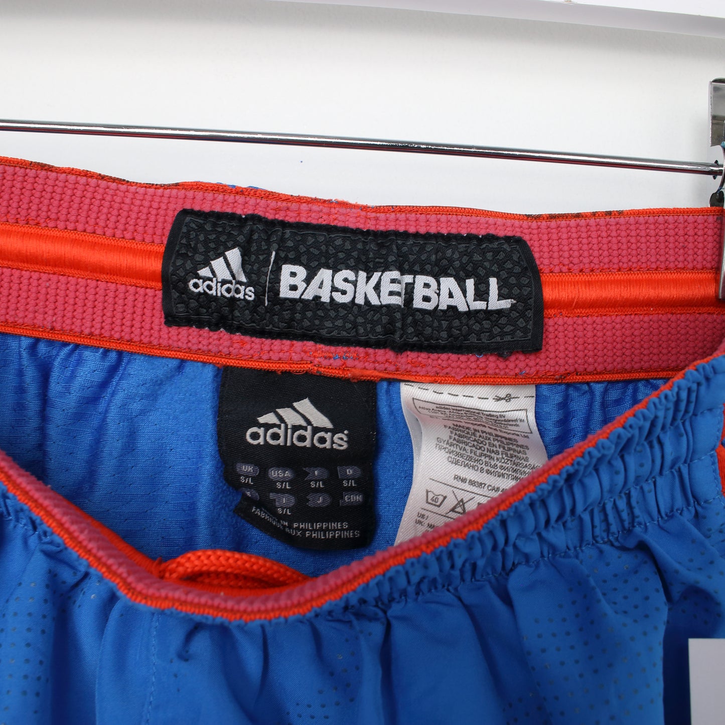 Vintage Adidas shorts in blue and orange. Best fits S