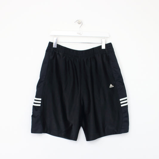 Vintage Adidas shorts in black. Best fits L