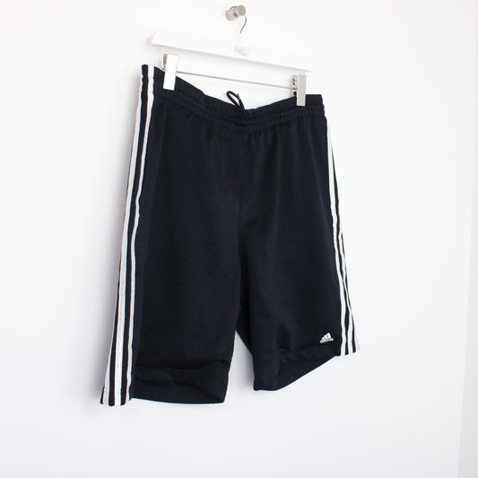 Vintage Adidas shorts in black. Best fits M