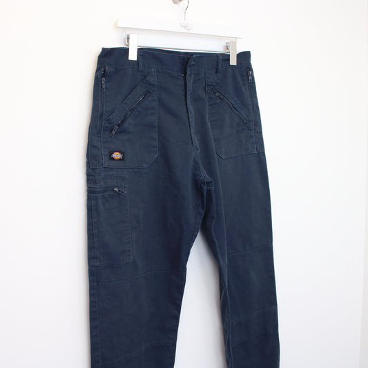 Vintage Dickies trousers in blue. Best fits W34 L30
