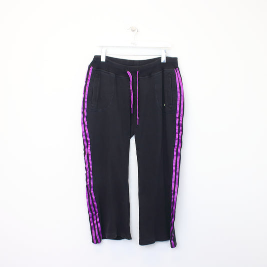 Vintage Women's Adidas joggers in black and purple. Best fits L