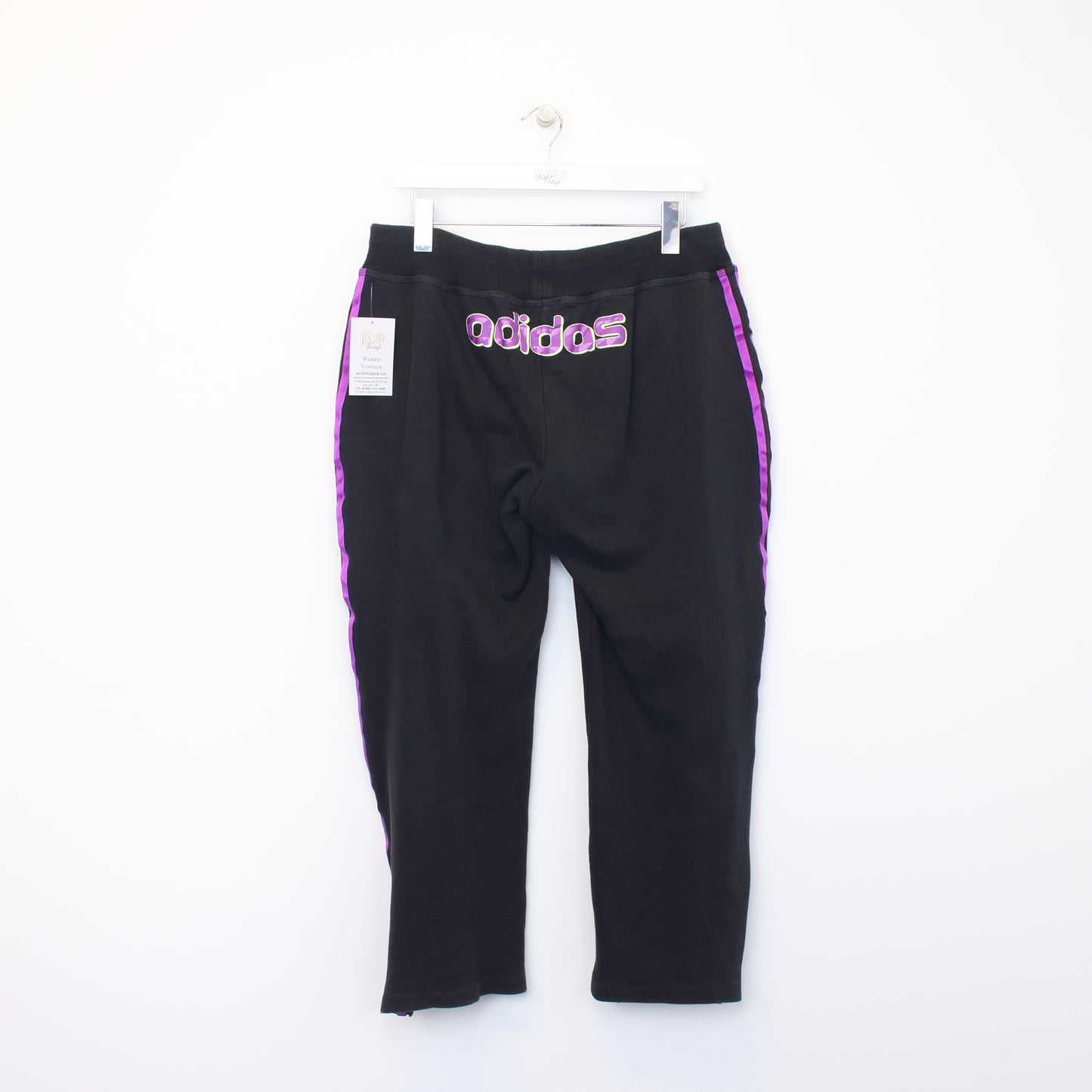 Vintage Women's Adidas joggers in black and purple. Best fits L