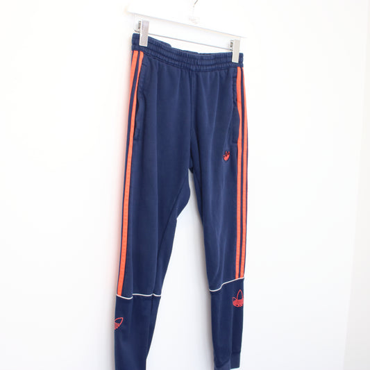 Vintage Adidas joggers in blue and orange. Best fits XS