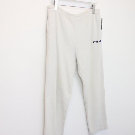 Vintage Women's FILA joggers in white. Best fits size 14