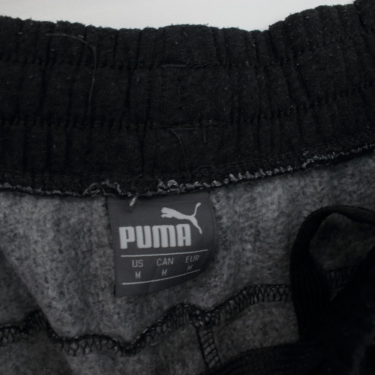 Vintage Puma joggers in black. Best fits M