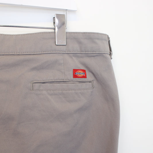 Vintage Woman's Dickies trousers in grey. Best fits W38