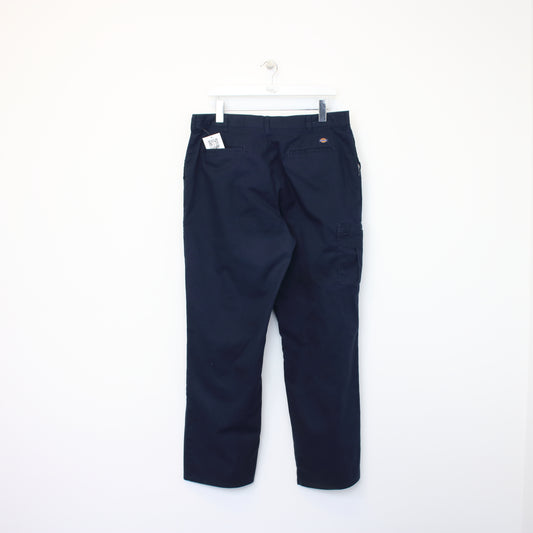 Vintage Dickies trousers in navy blue. Best fits W42