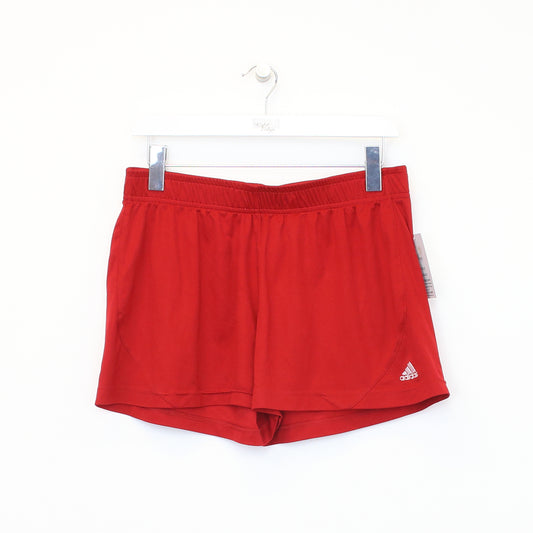 Vintage Adidas shorts in red and white. Best fits L