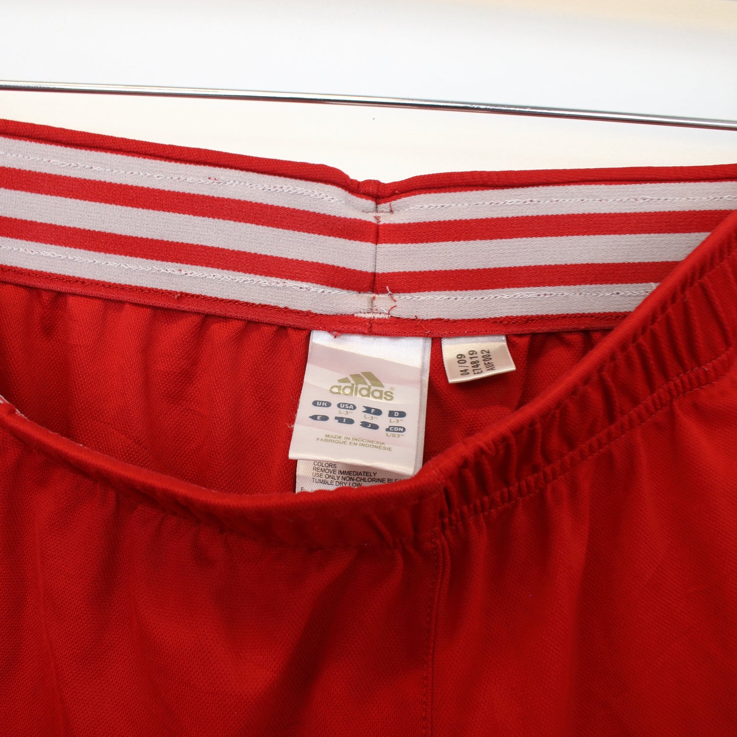 Vintage Adidas shorts in red and white. Best fits L