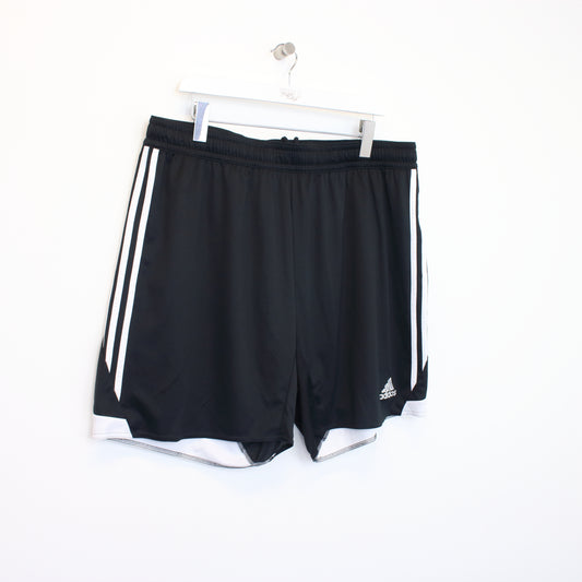 Vintage Adidas shorts in black and white. Best fits XXL