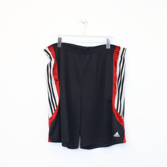Vintage Adidas shorts in black and red. Best fits XXL