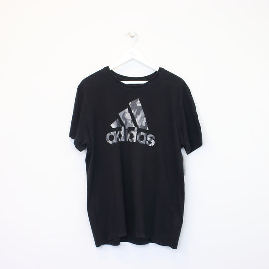 Vintage Adidas spell out T-Shirt in black. Best fits XL