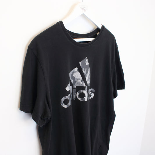 Vintage Adidas spell out T-Shirt in black. Best fits XL