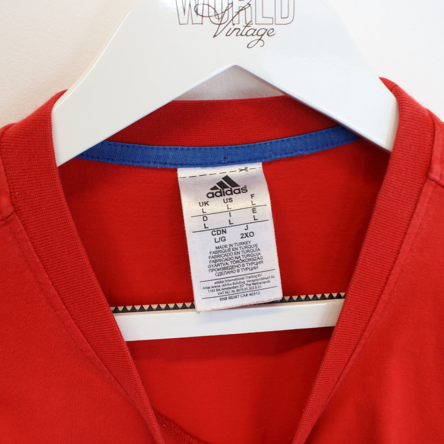 Vintage Adidas T-Shirt in red. Best fits L